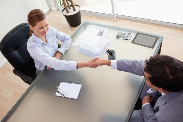 Shaking hands at successful job interview